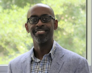 Amin Davis — symposium speaker portrait