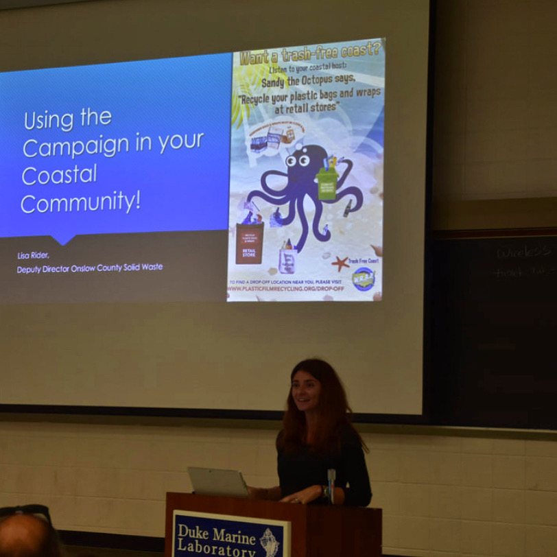 Presenter sharing a coastal community campaign with an audience