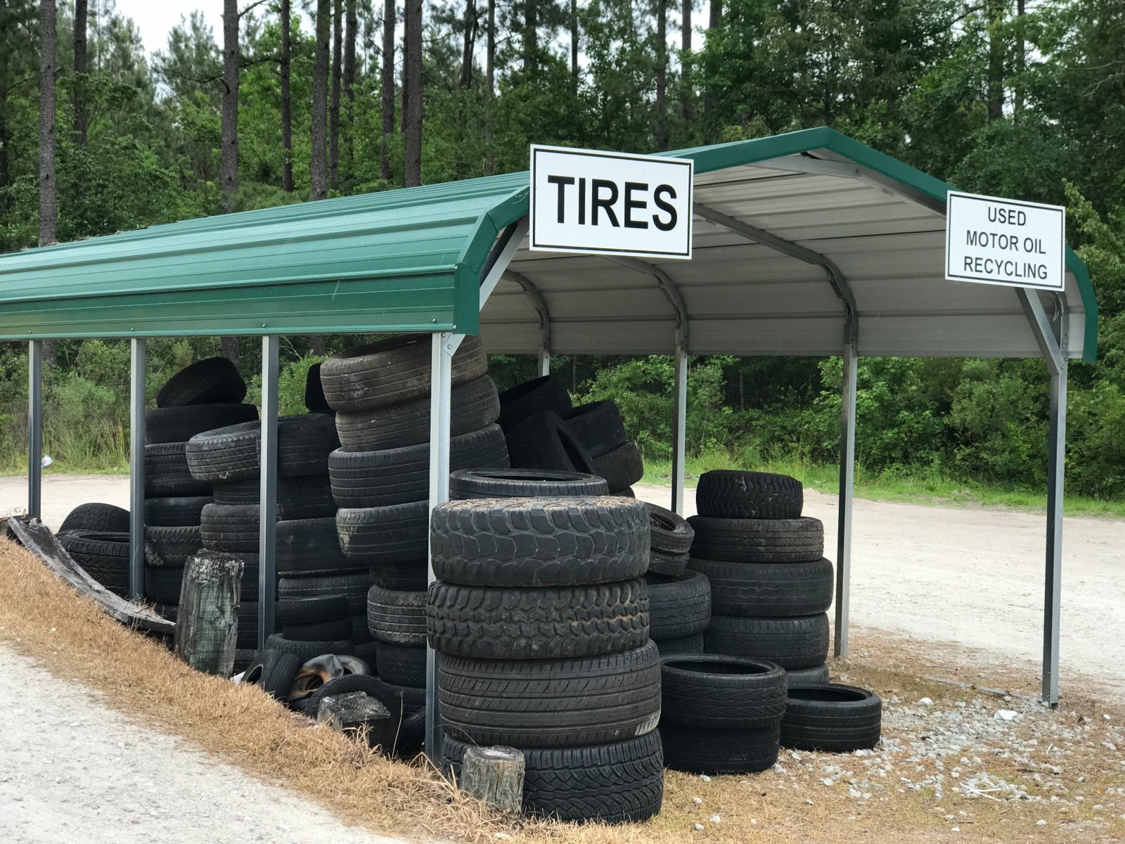 Used tires collected under a marked drop-off shelter